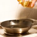 pouring oil into pan