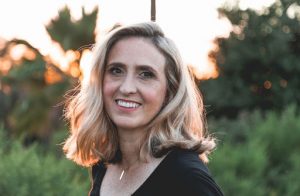 woman smiling sunset