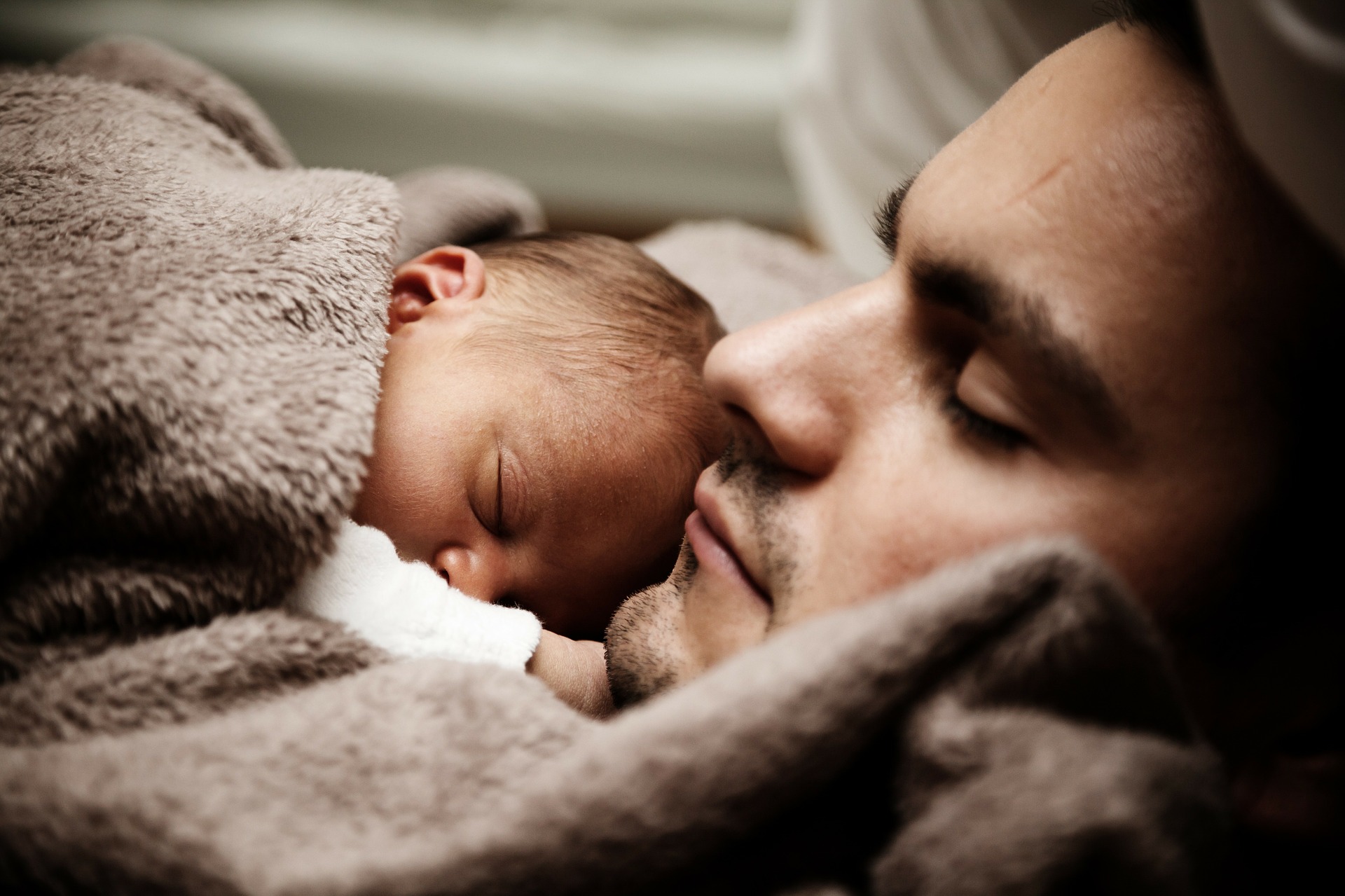 father and baby asleep